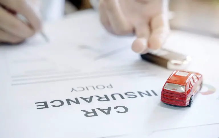 A person signing a car insurance policy