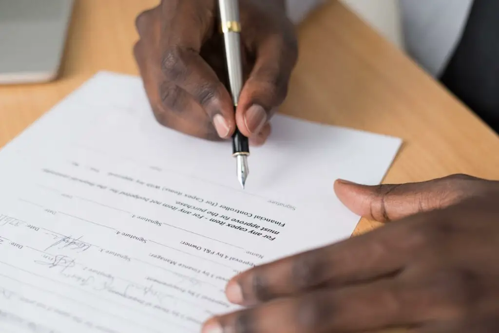 Man signing a contract 