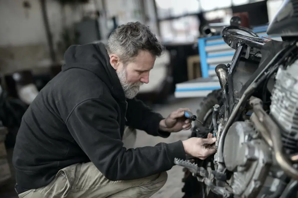 A man repairing an engine