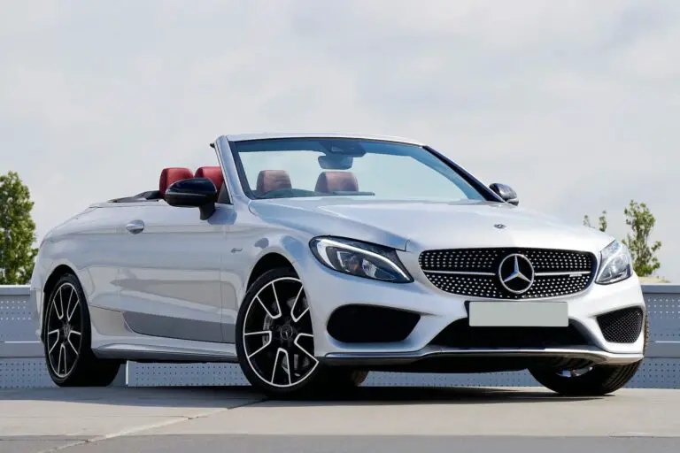 A white convertible Mercedes on a parking lot