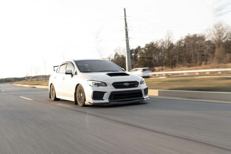 A white Impreza on the road